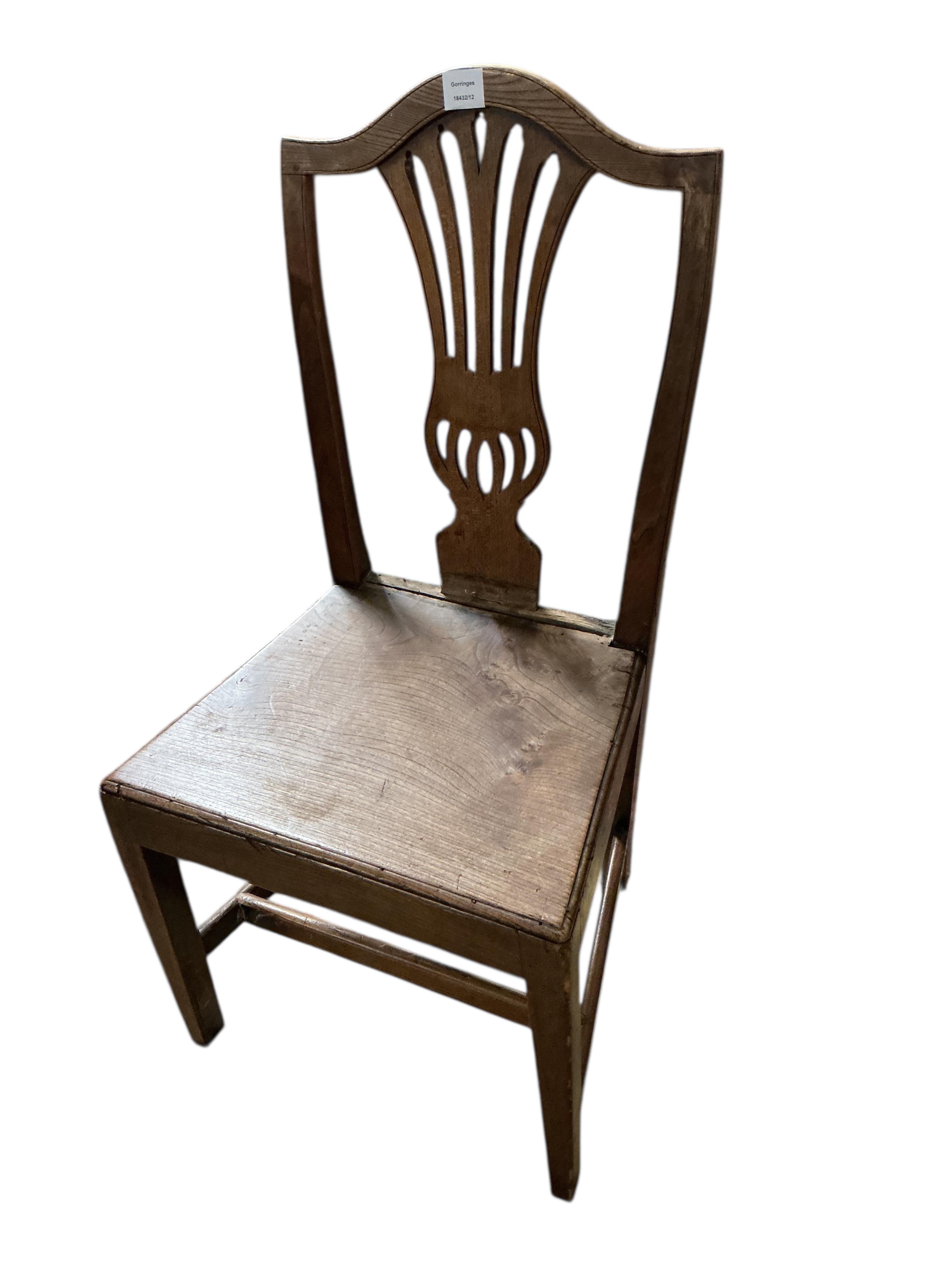A set of three George III Provincial elm dining chairs, width 49cm, height 99cm